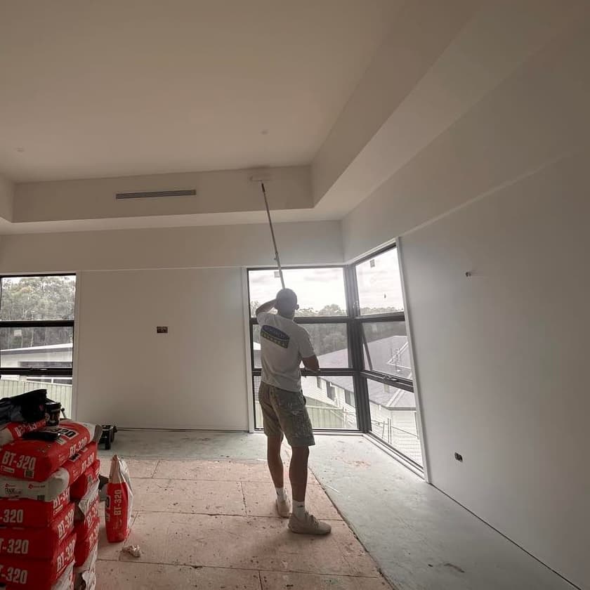 Rolling paint onto an interior wall